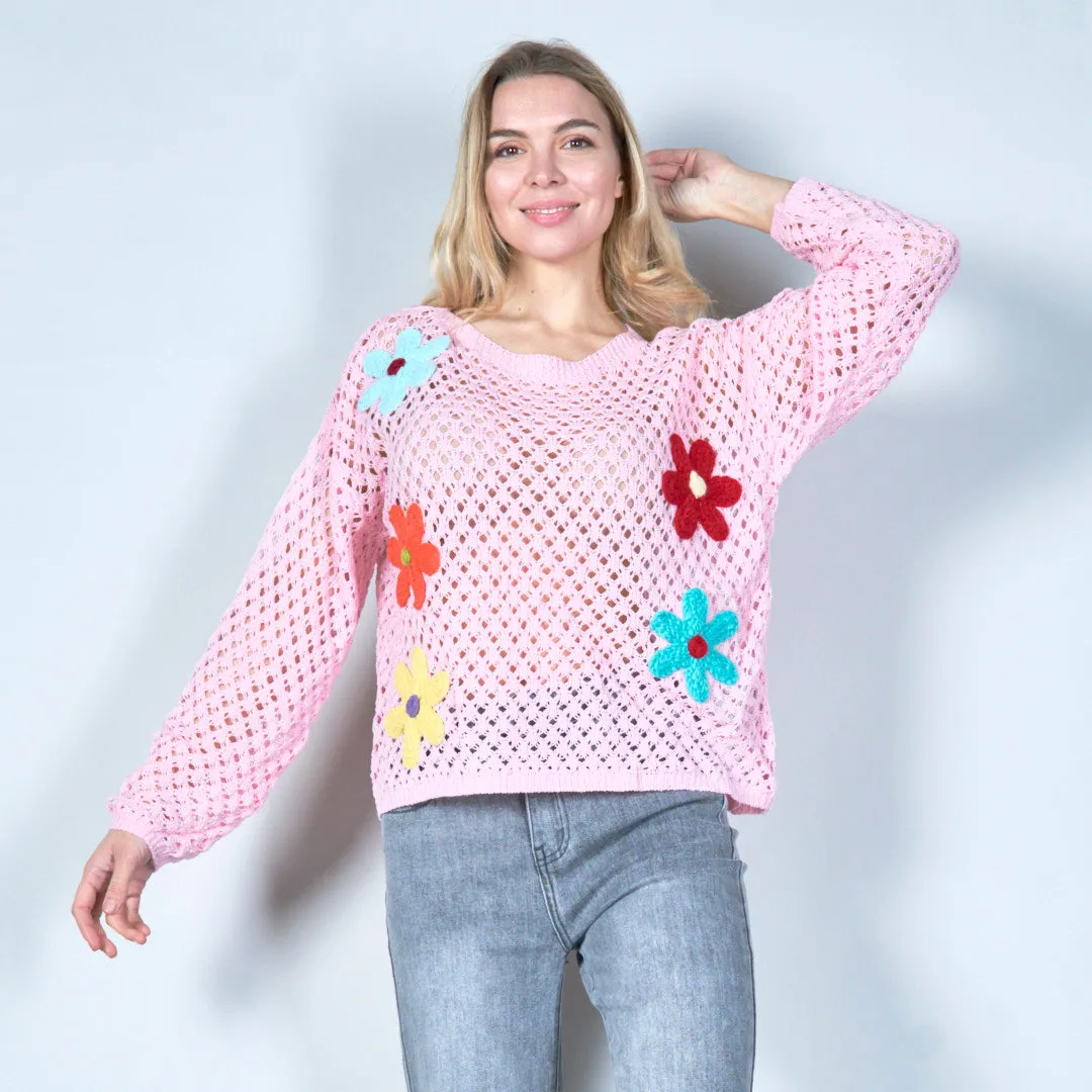 Open-knit sweater with colorful floral applique wholesale