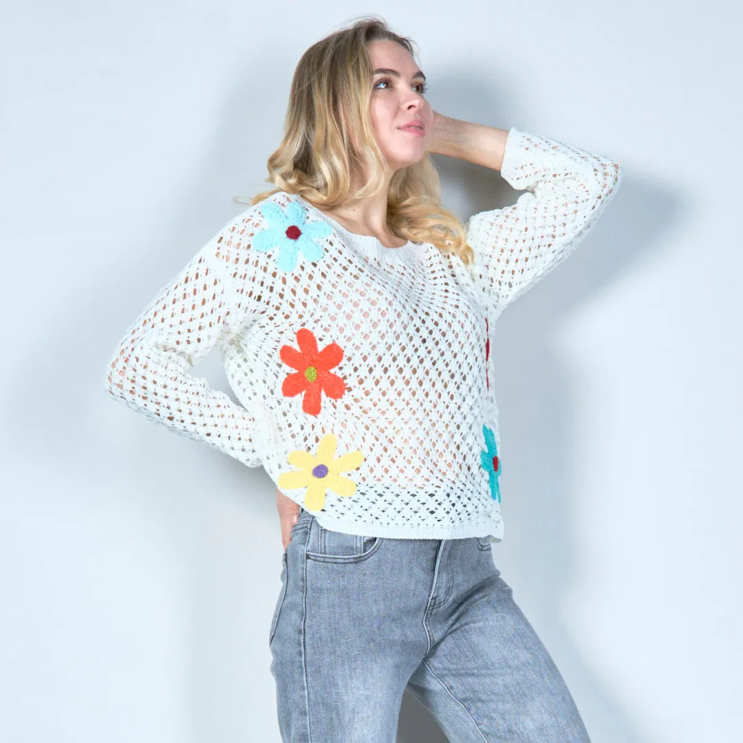 Open-knit sweater with colorful floral applique wholesale